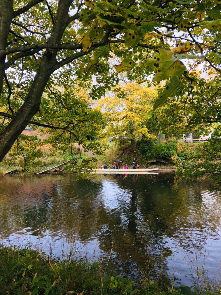 picture of people in a canoe on the river wear