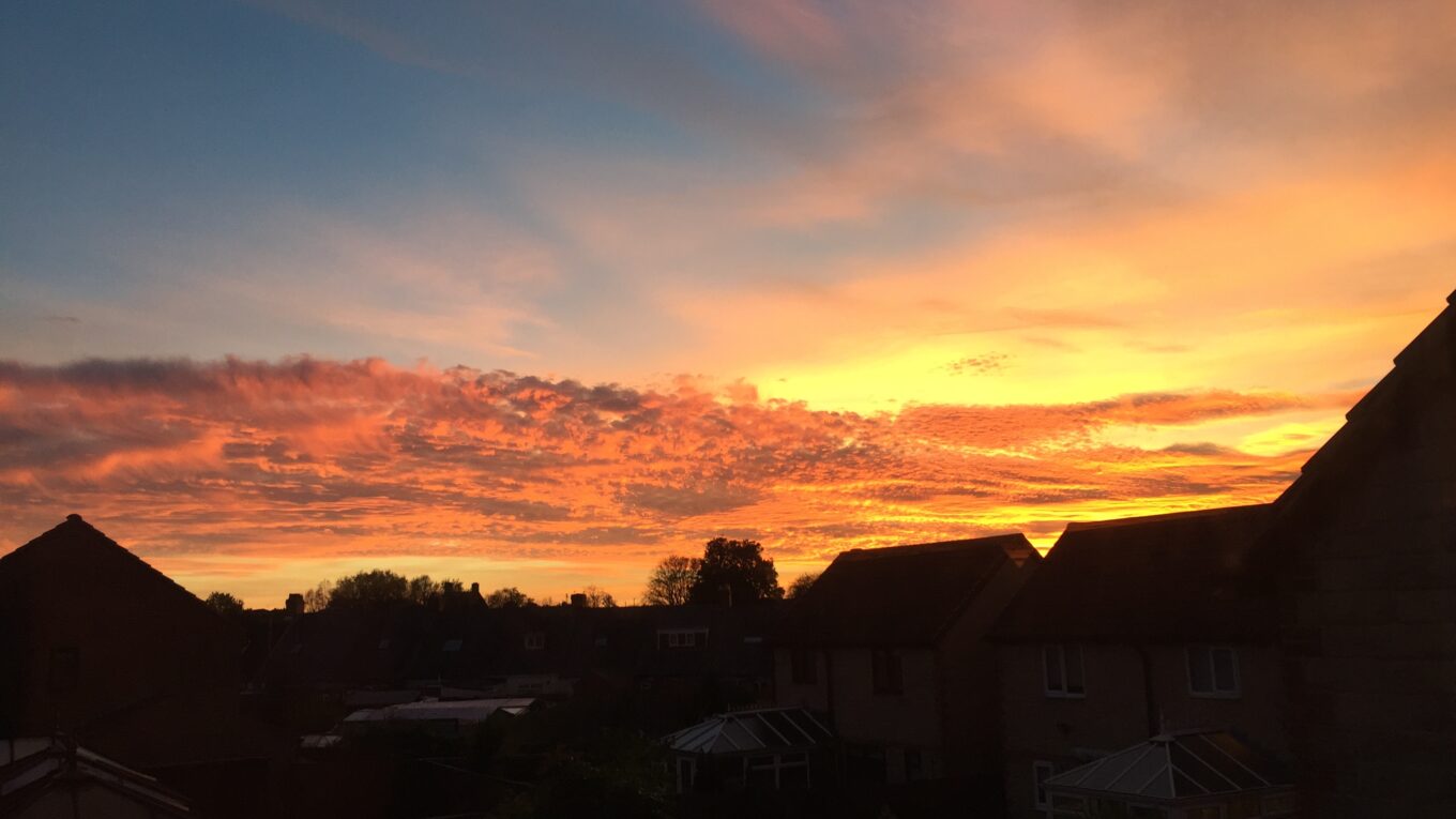 Sunset in Durham Gilesgate in October 2018 with house line silhouetted against a fiery red sky