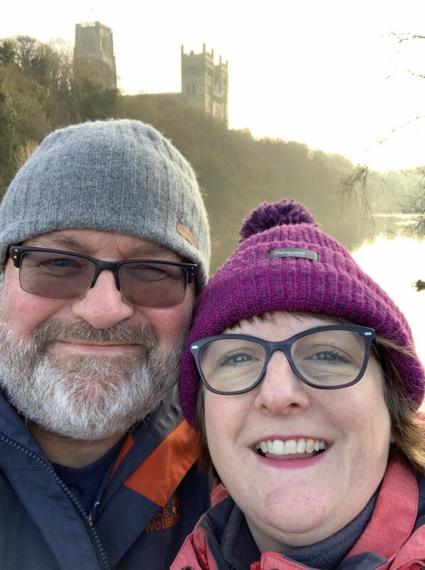 picture of dave and debbie on framwelgate bridge with durham cathedral in the background