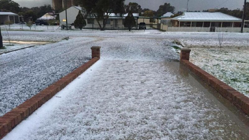 Moderate hail whitens the ground