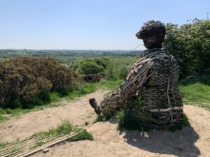 Wicker miner statue looks over the wear valley flood plain