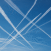 Contrails Crisscrossing The Clear Sky