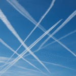 Contrails Crisscrossing The Clear Sky
